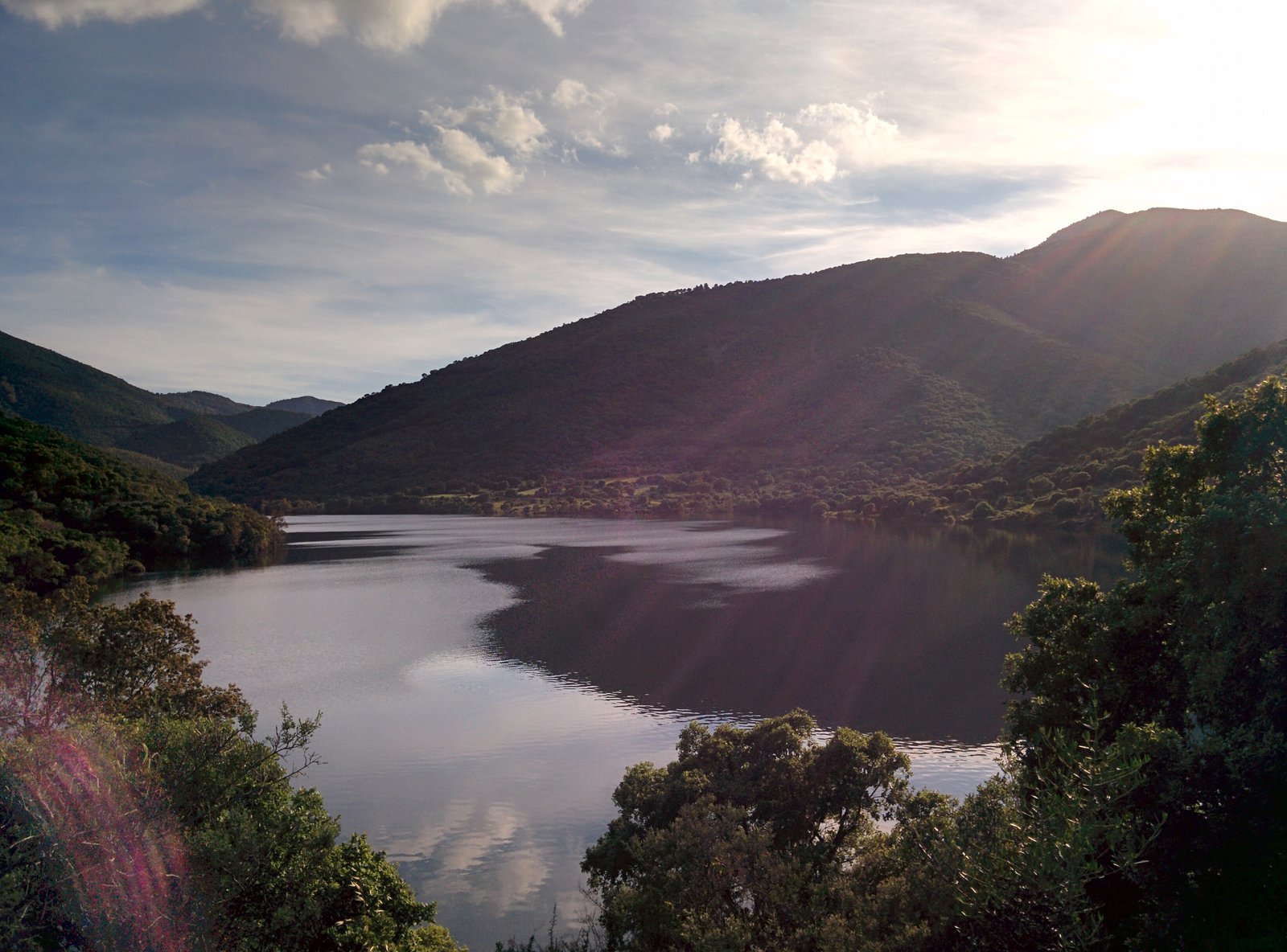 Lago del Leni reservoir framed by mountain ridges in Villacidro